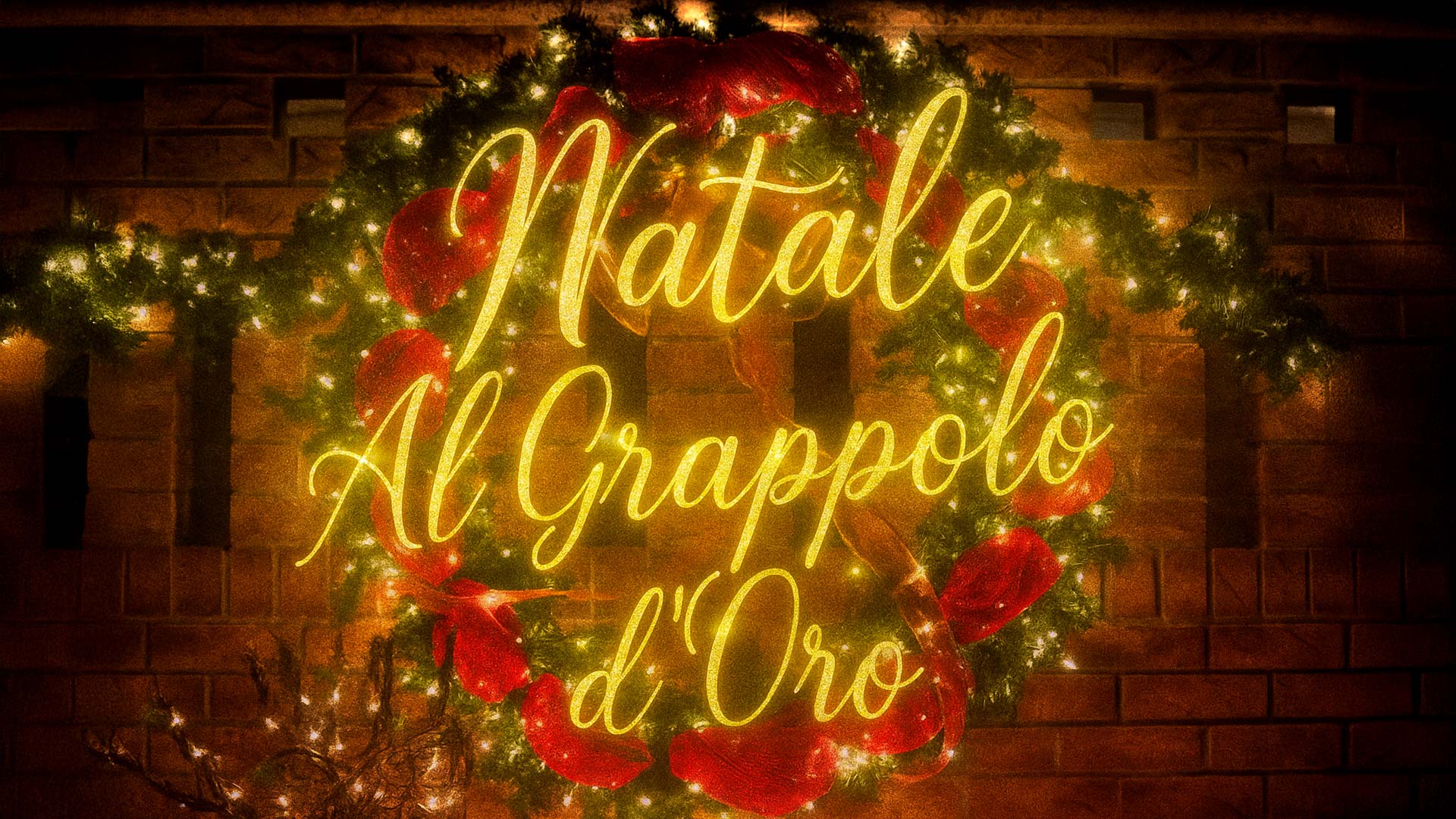 Insegna luminosa con ghirlanda natalizia e scritta “Natale al Grappolo d’Oro” decorata con luci e fiocchi rossi, facciata del Boutique Hotel Al Grappolo d’Oro a Torgiano in Umbria